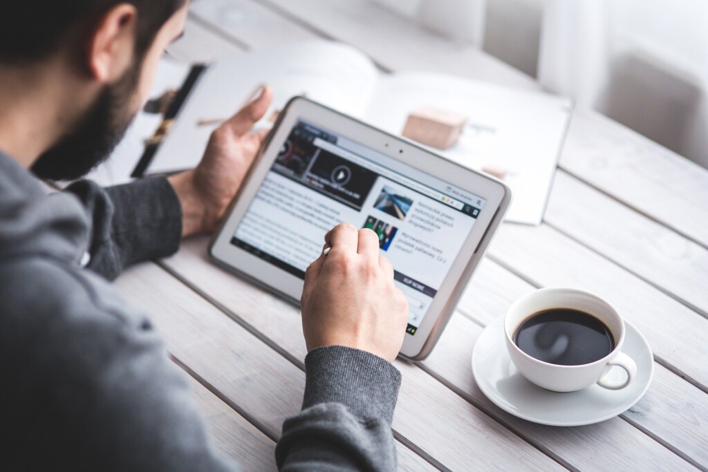 Man Reading Touchscreen Blog Digital Tablet
