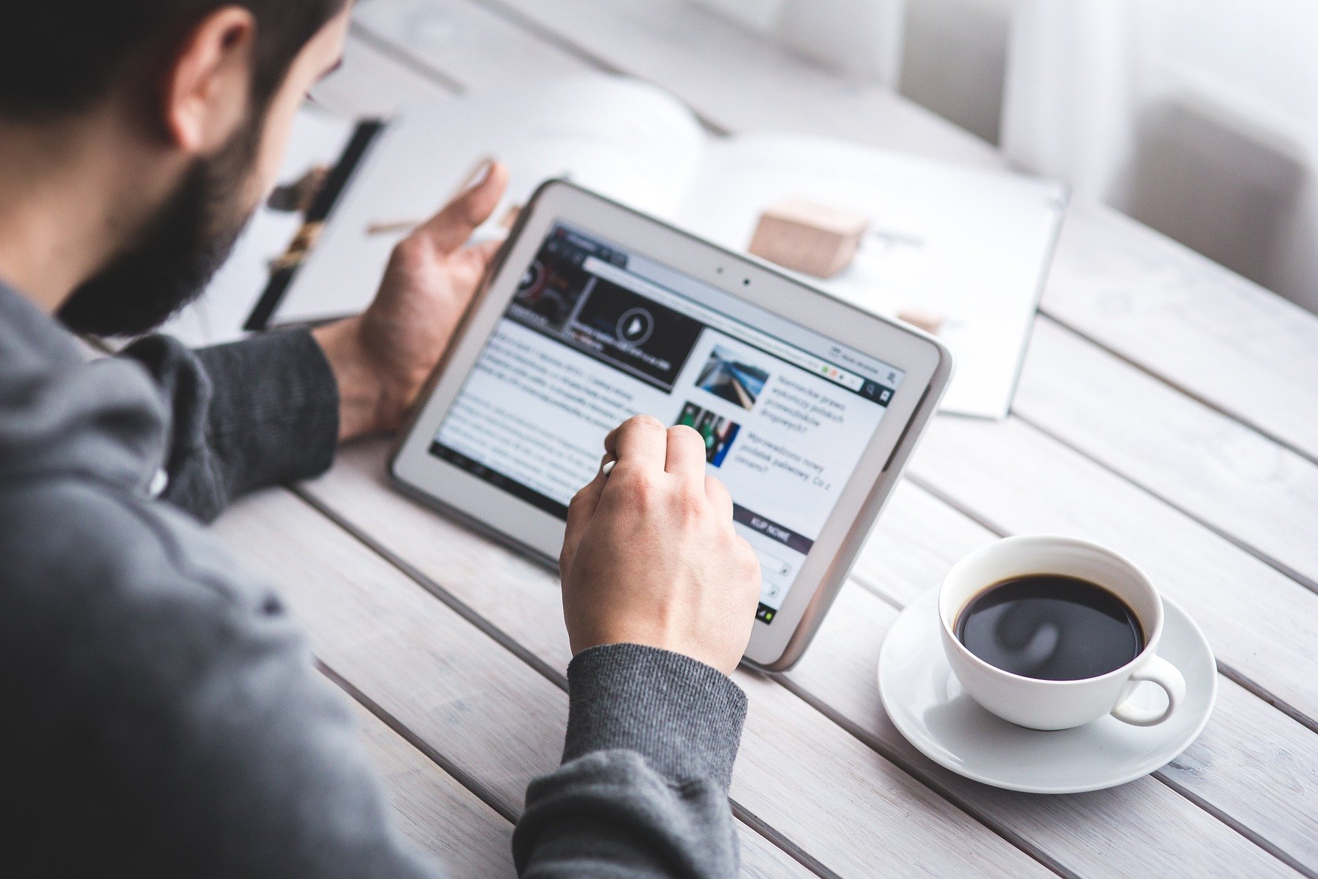 Man Reading Touchscreen Blog Digital Tablet